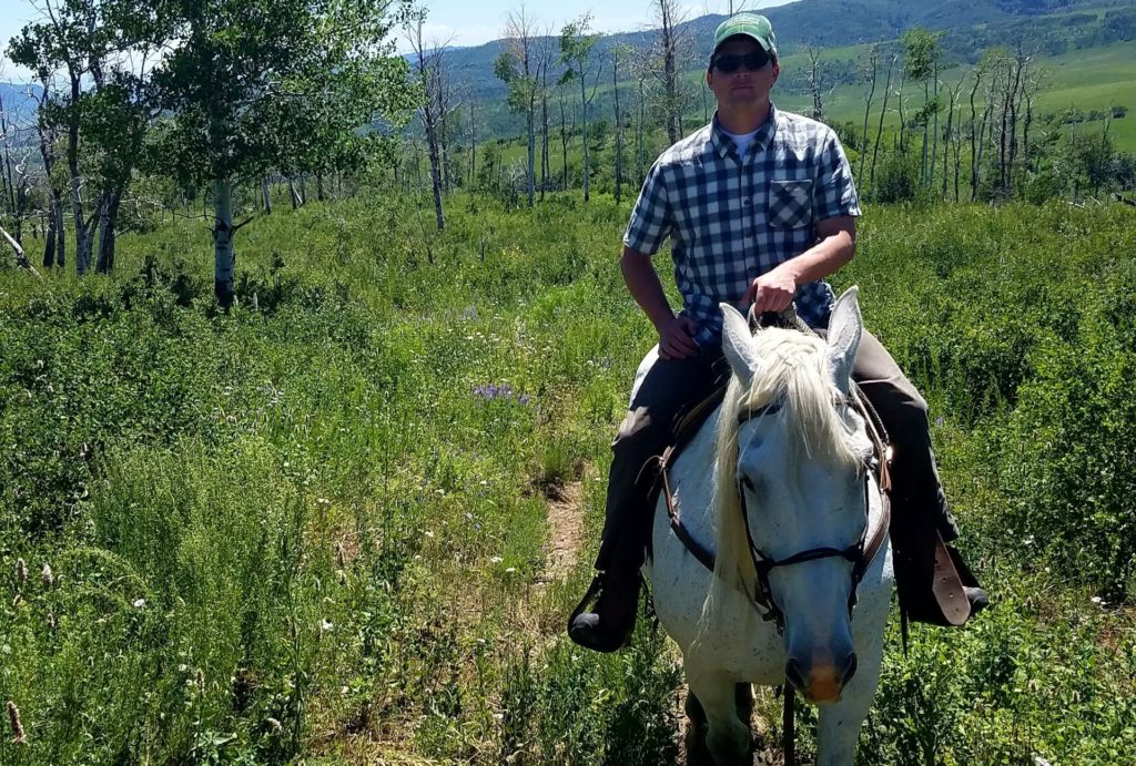 John Byerly riding a horse