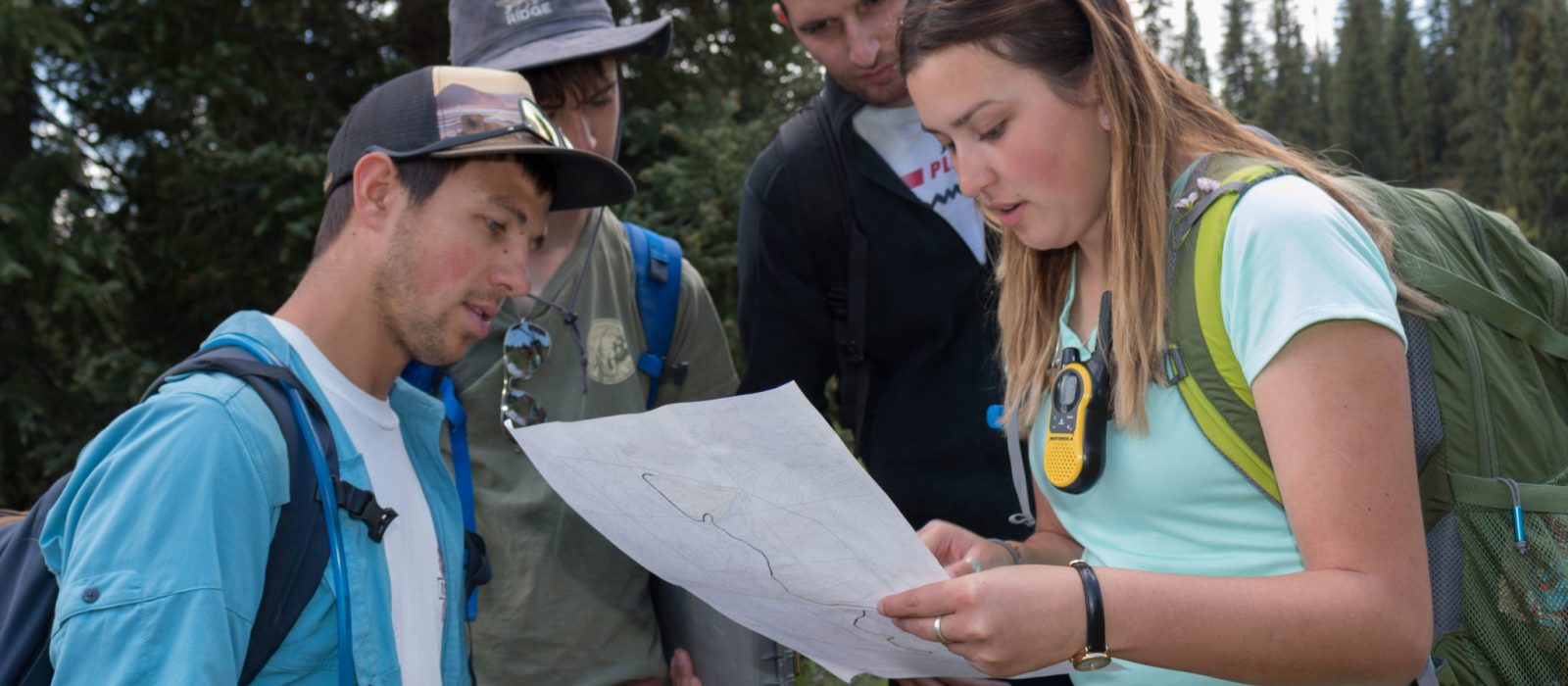 Students examining map in the field