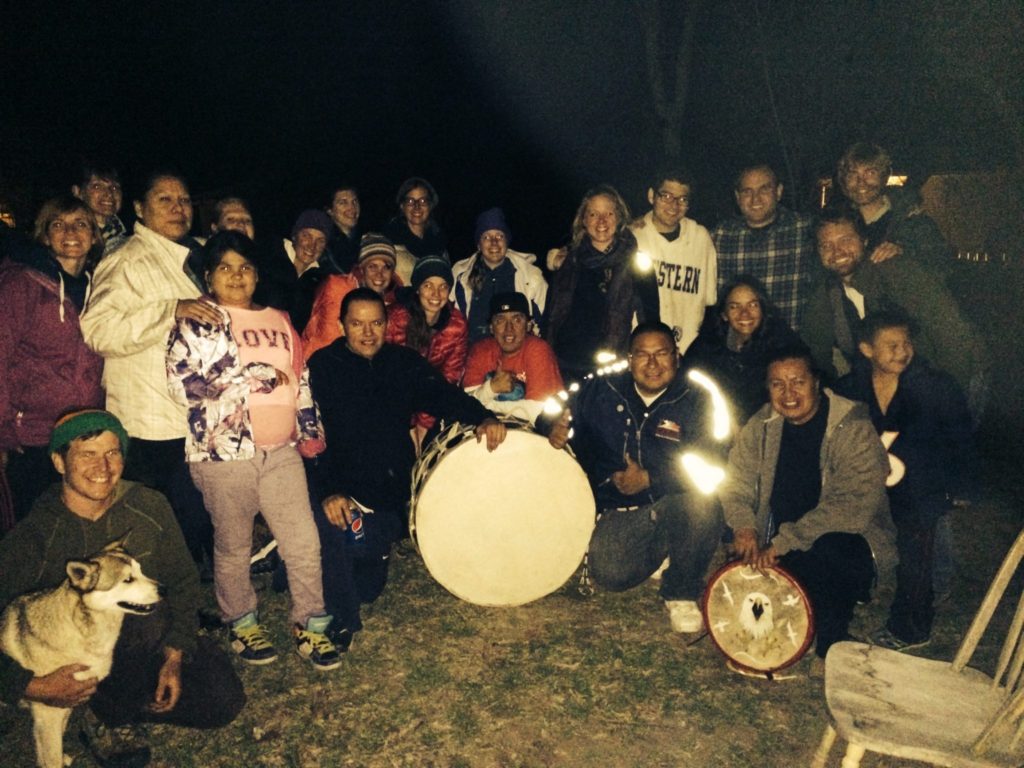 a group of people pictured at night