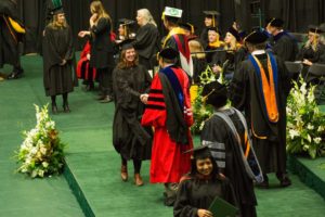 Graduate shaking hands