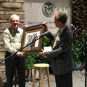 Photo of Frank Ethridge receiving gift at the Ethridge Symposium 2018
