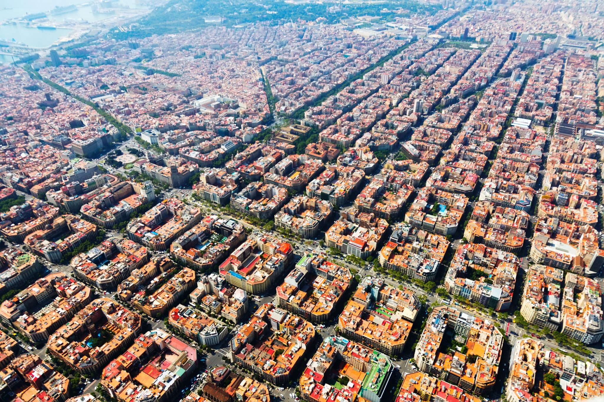aerial view of a city laid out in grid pattern highlighting human impacts