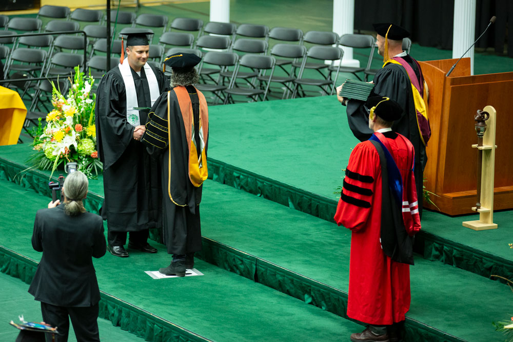 Graduate receives his diploma
