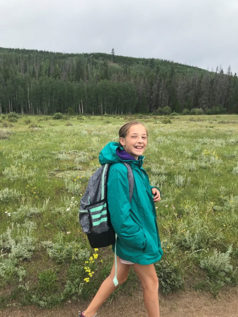 A happy camper out on a hike