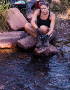 Water Resources student takes samples on the Poudre River