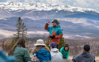 Colorado State University Forestry and Rangeland Stewardship professor Troy Ocheltree describes the alpine environment to NR 220 students on the Crown Point Trail near the CSU Mountain Campus, June 6, 2023.