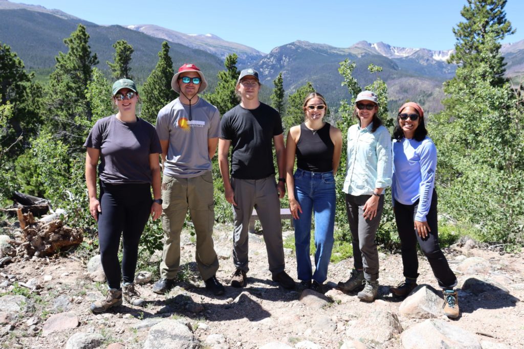 six PSM students posing on the top of a mountain in Colorado