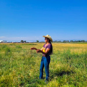 Woman in a cowboy hat teaches regenerative farming to graduate students